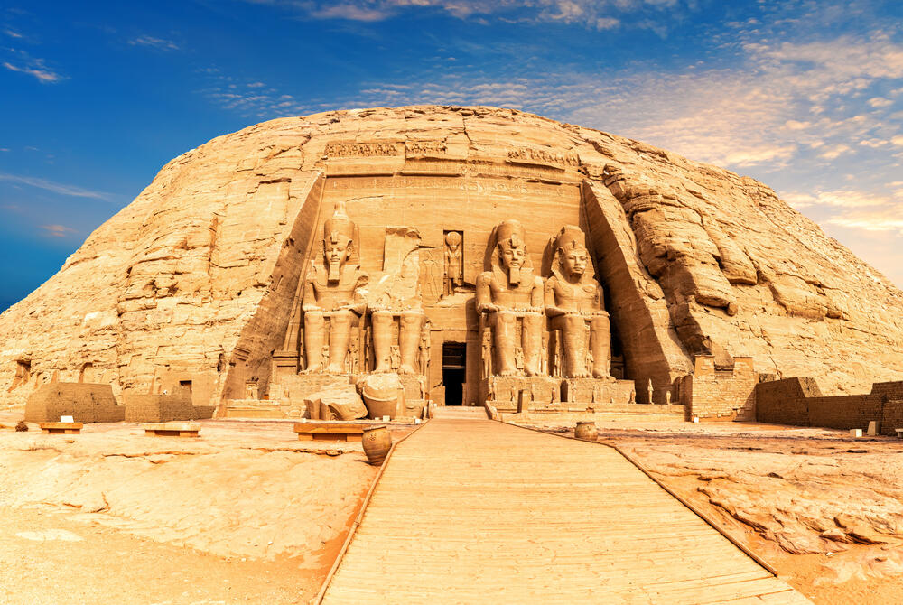Abu Simbel, Egypt View of the outside of the temple of Abu Simbel in Egypt. Giant pharaoh statues guard the entrance, carved into the rock.