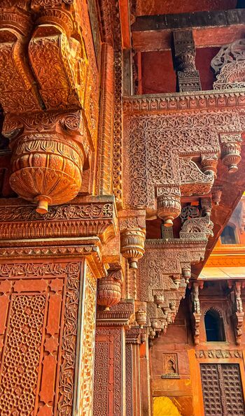 Carved red sandstone columns inside Agra fort