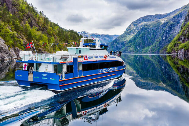 Image of fjord cruise with towering mountains and scenic fjord views