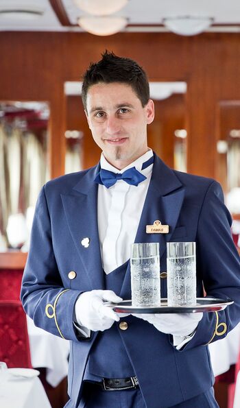 Steward in the dining car aboard the Golden Eagle Danube Express