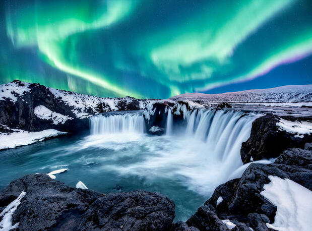 Northern Lights over Godafoss waterfall, North Iceland