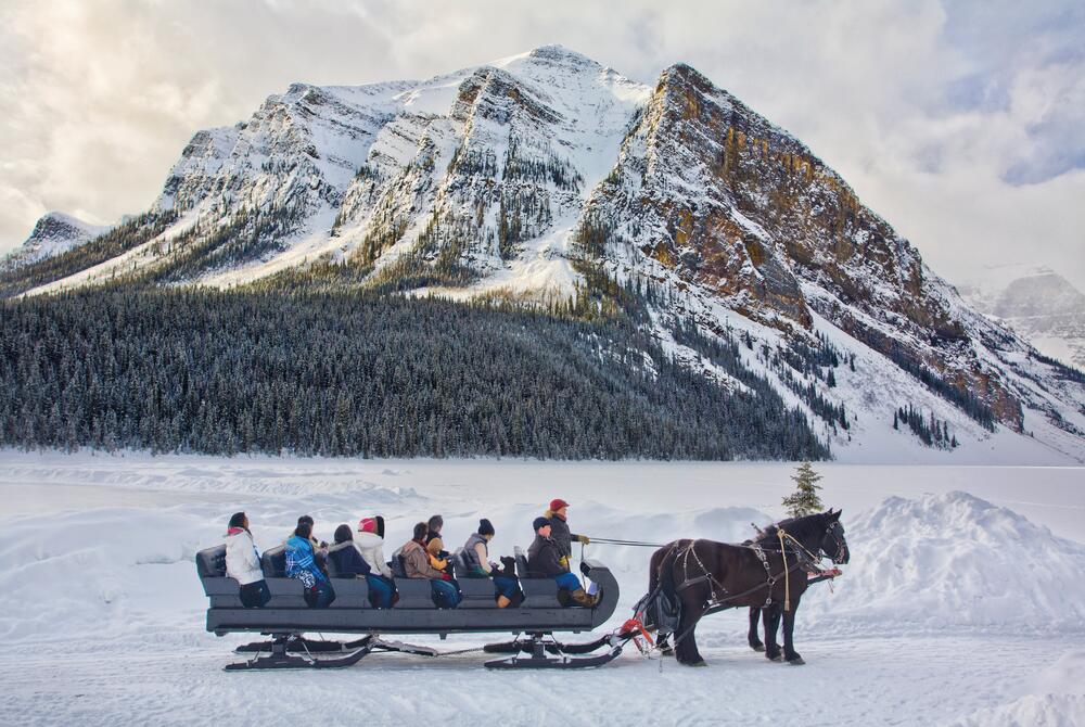 A horse-drawn sleigh ride on the frozen waters of Lake Louise in Alberta