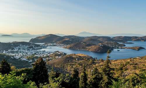 View over the rolling green hills and shores of Patmos, Greece