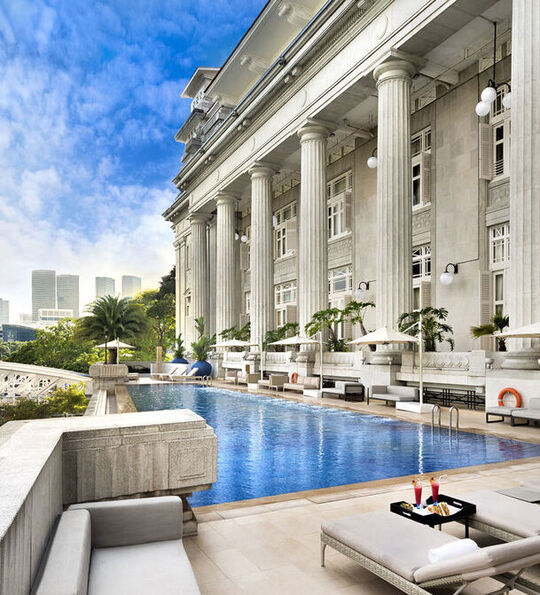 Image of Swimming Pool at The Fullerton Hotel Singapore, with views across skyline
