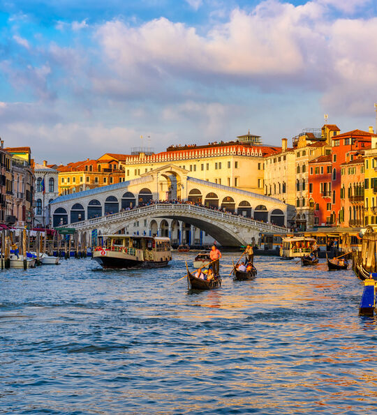 Rialto Bridge over the Grand Canal in Venice at sunset