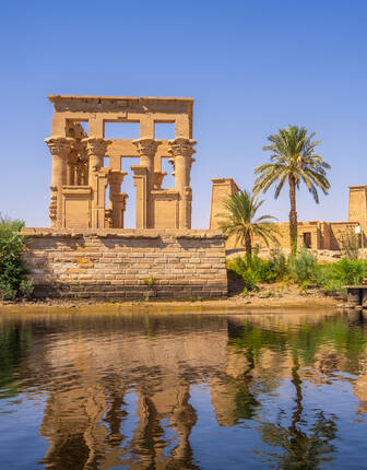 The beautiful temple of Philae and the Greco-Roman buildings seen from the Nile river, a temple dedicated to Isis, goddess of love. Aswan. Egypt