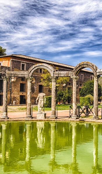 The ancient pool called Canopus, surrounded by greek sculptures in Hadrian's Villa, Tivoli, Italy