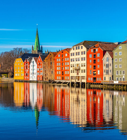 Old colourful warehouses lining the river in Trondheim, Norway