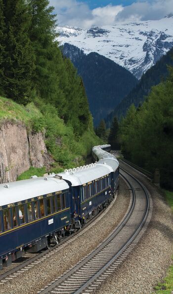 Venice Simplon-Orient-Express passing through the Alps in Europe